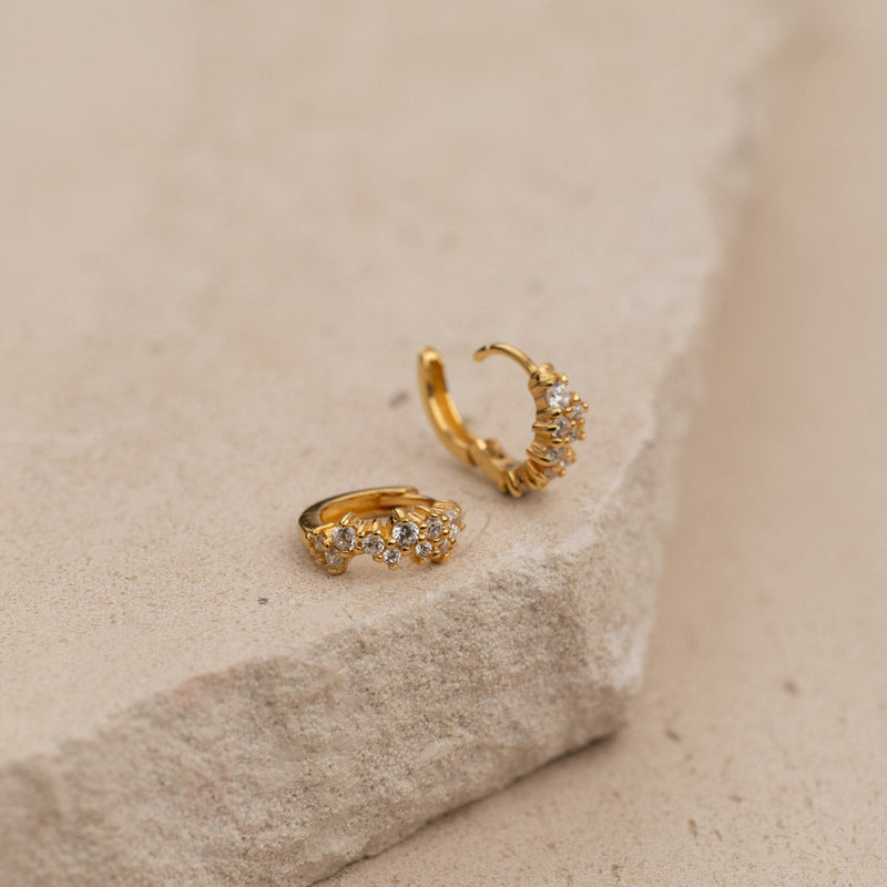 CLAIR CRYSTAL GOLDEN MINI HUGGIE EARRING